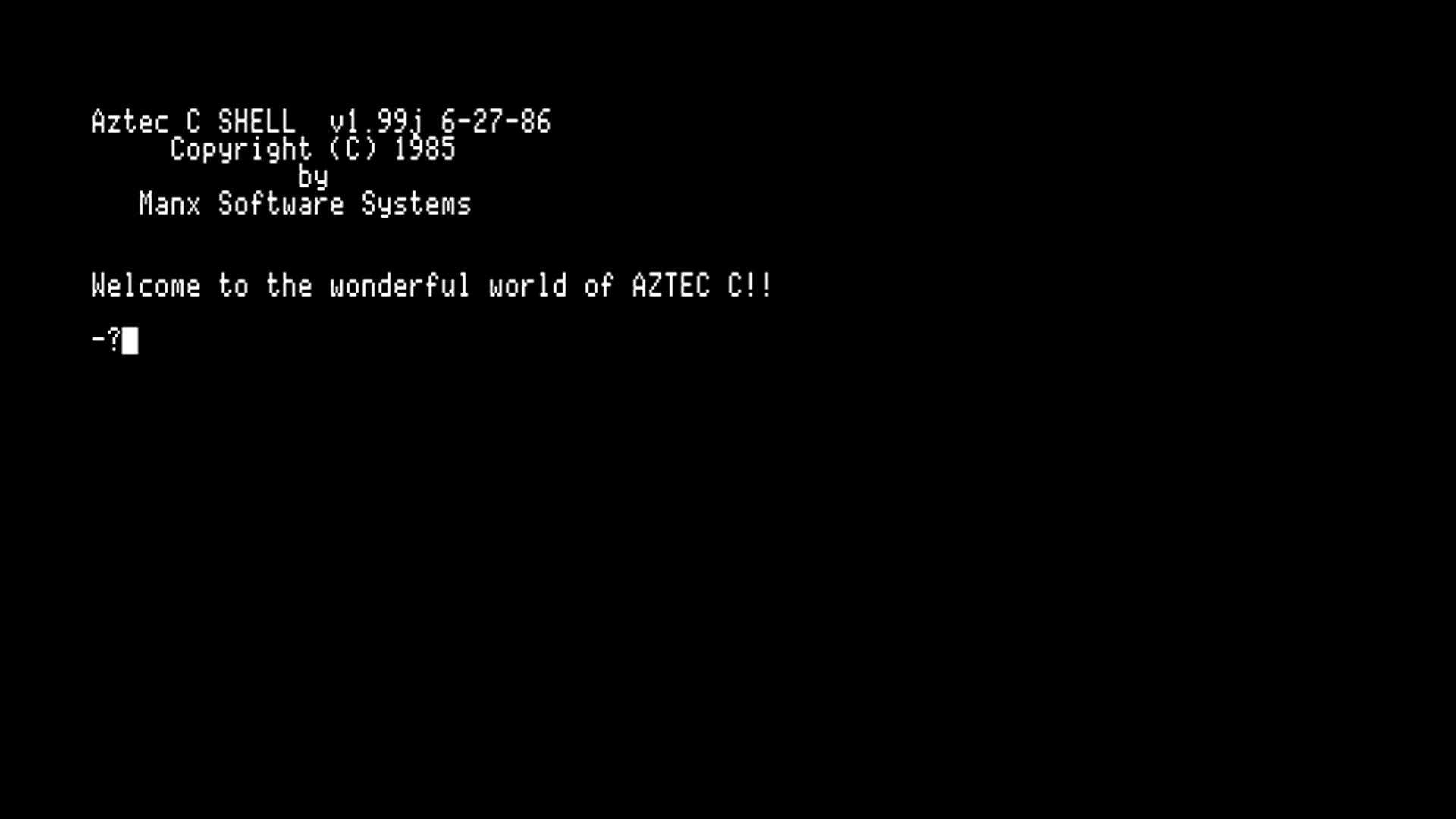 First boot of the merged disk. Aztec C SHELL v1.99j, PROFILE banner, prompt.