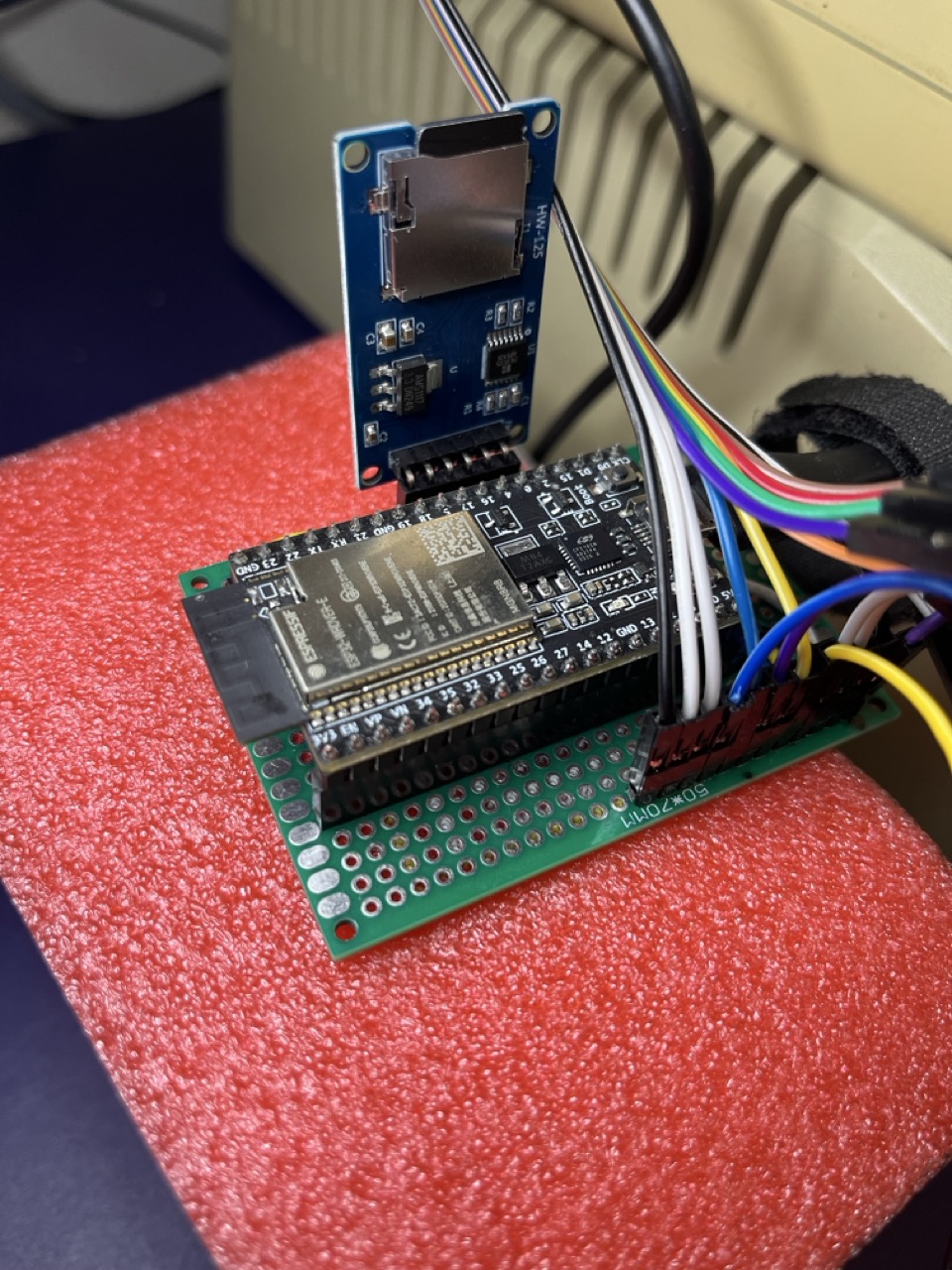The ESP32 DevKitC WROVER on perfboard, ribbon cable to the card's GPIO header.
