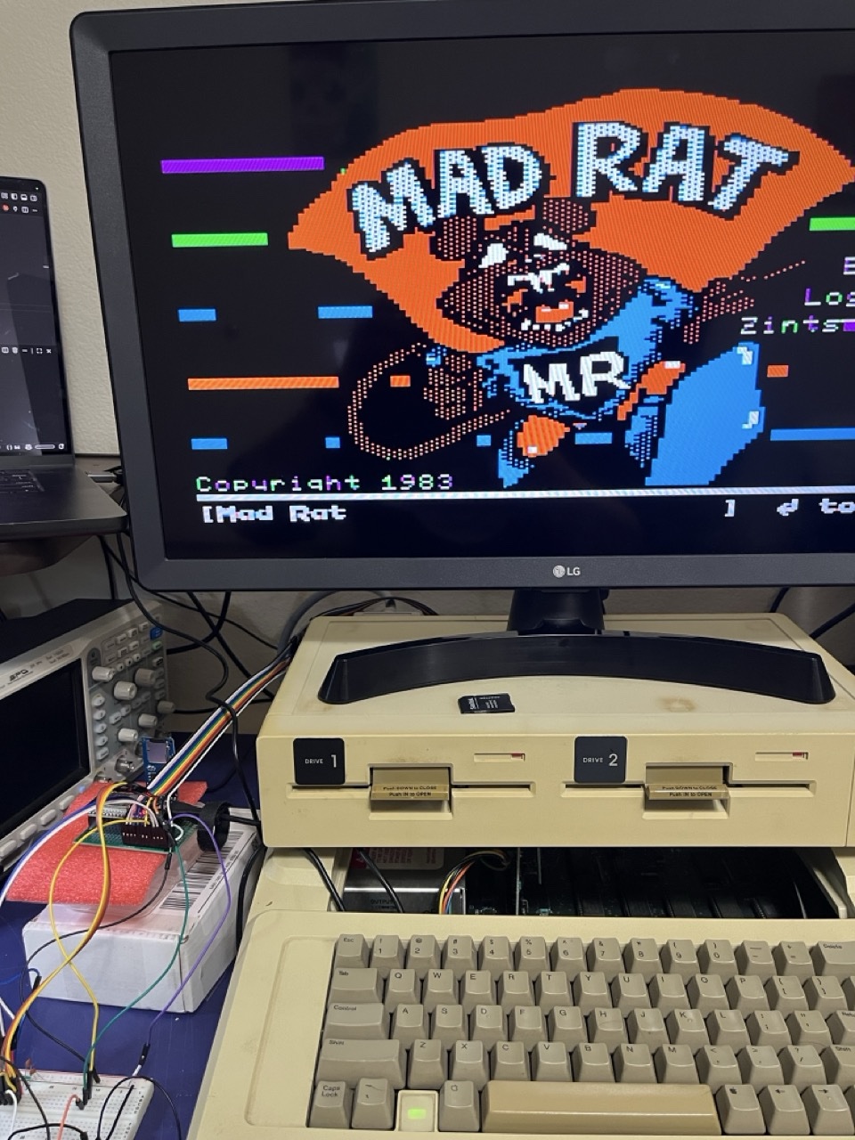 Mad Rat on the IIe, the ESP32 rig sitting on the case.