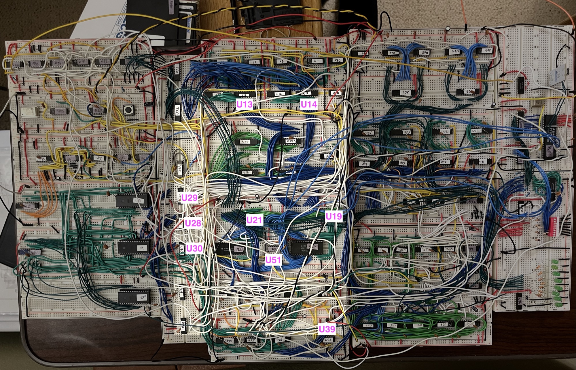 Where some of the DMA hook chips sit on the bench. U13/U14 are the PC's address drivers, U28-U30 the decoder enables, U21 and U51 on the RAM path, U39 on the MDR read. The MAR drivers U54/U59 and the RAM are on the same center board.