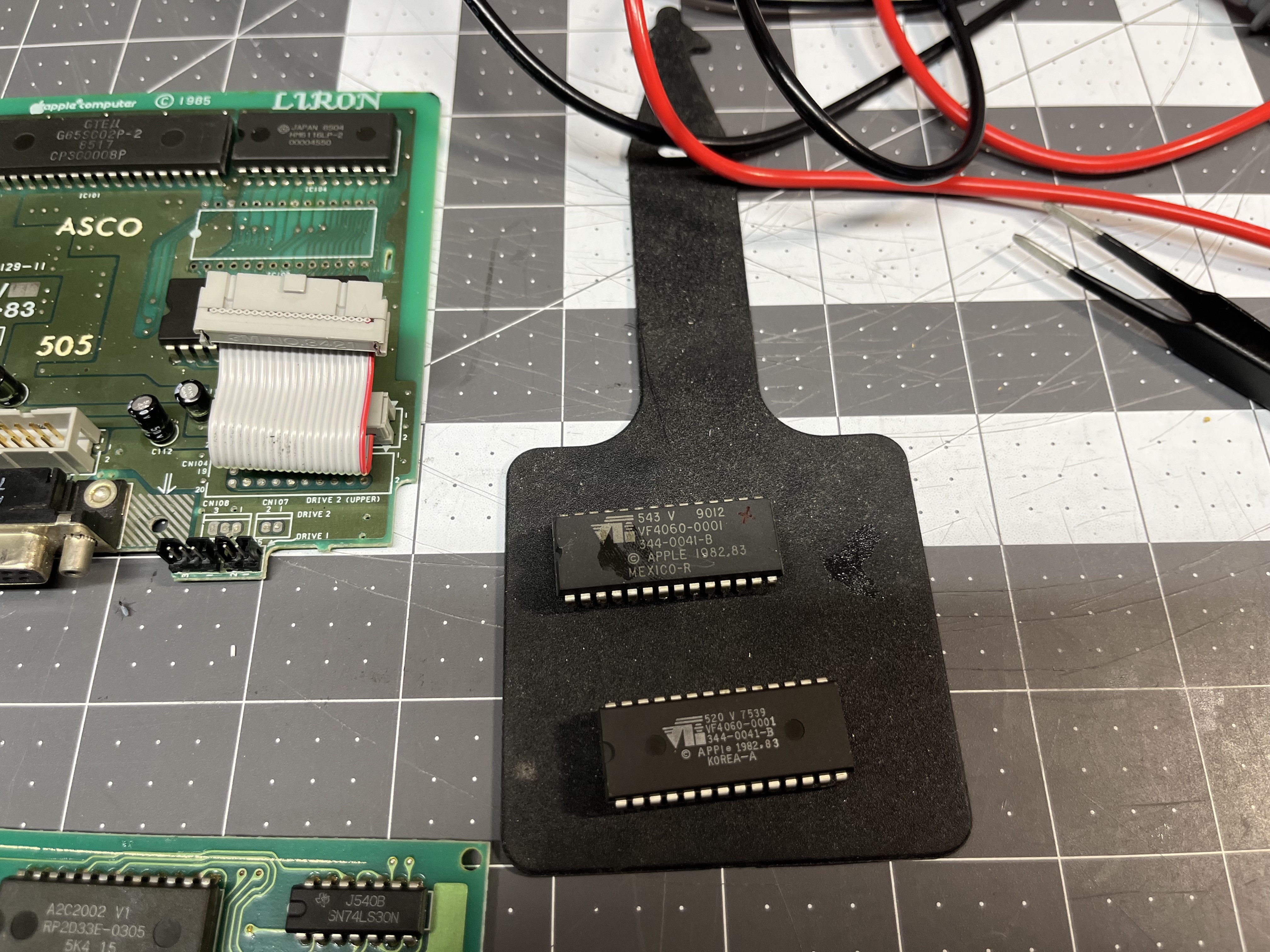 The dead IWM from the Liron (top, marked with an x) and the donor from a dead IF-83 drive board (bottom). Both are 344-0041-B.