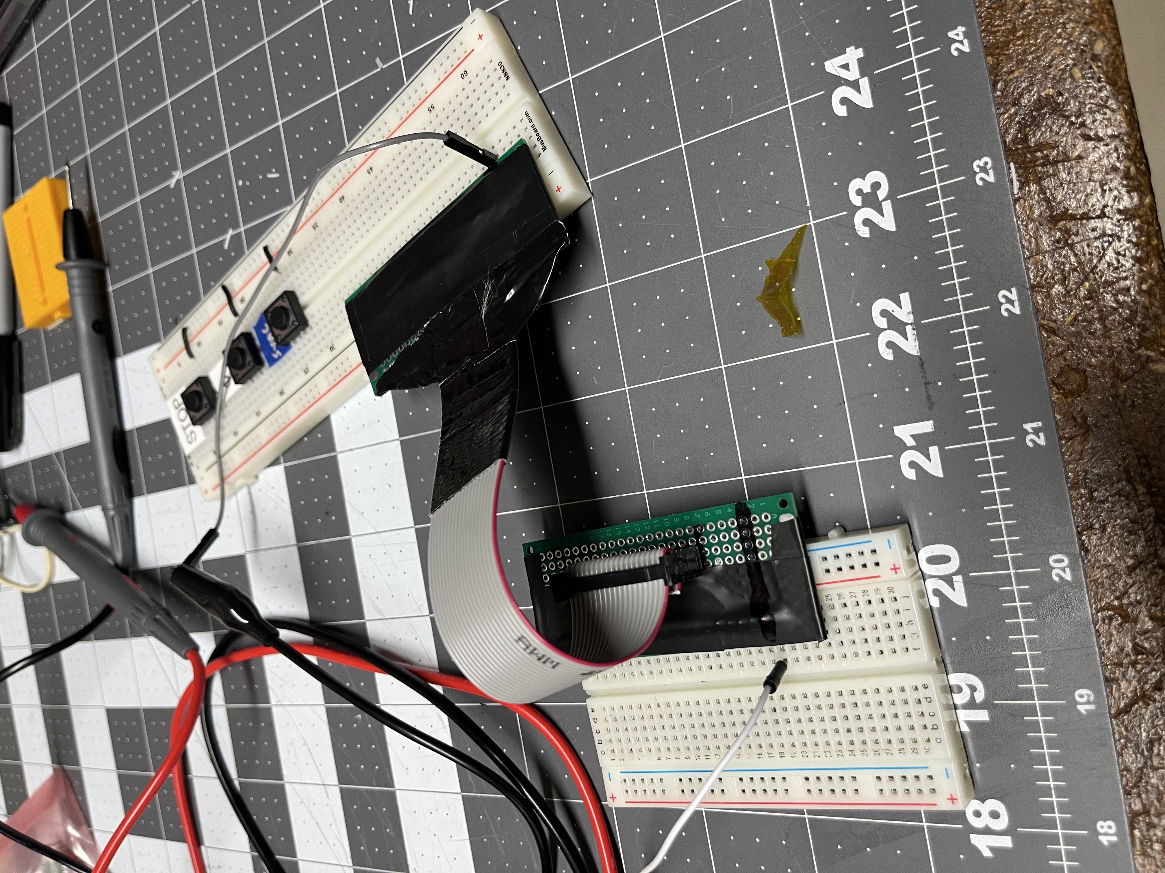 Both adapters on breadboards with the 20-pin ribbon plugged in, during the beep checks.