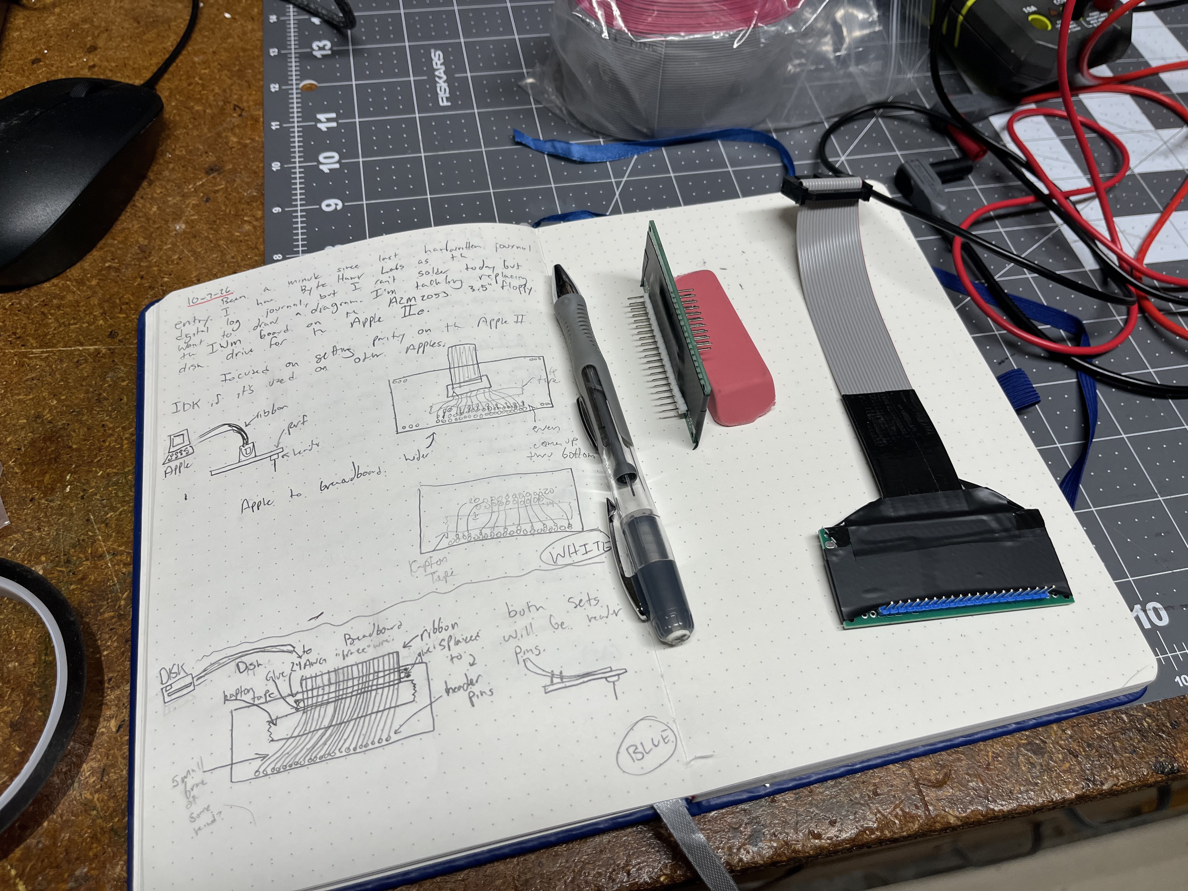 Notebook page from 2026-10-07 with the two cable adapters sketched out, next to the finished ones.