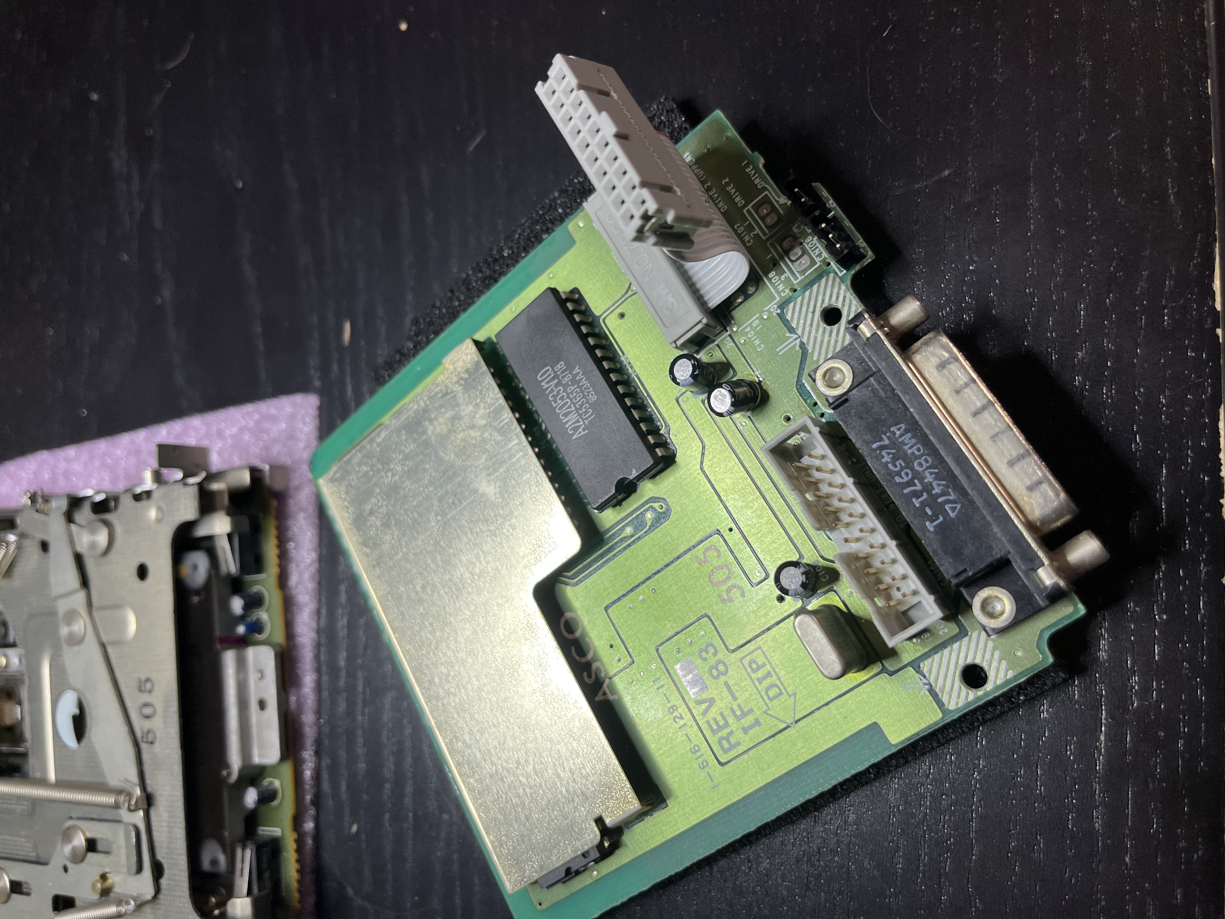 The UniDisk 3.5 controller board (IF-83) out of the drive, with the Sony mechanism behind it.